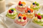 Beautiful Pastel Mini Cakes Topped with Fresh Fruit for Elegant Desserts