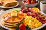 Hearty Breakfast Spread on a Rustic Wooden Table for a Cozy and Delicious Family Morning