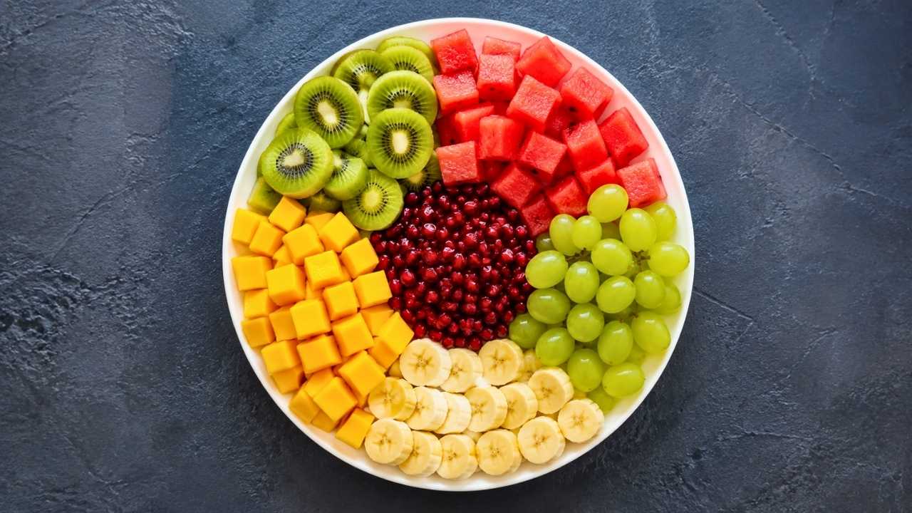 Colorful Fruit Platter on White Plate: Fresh, Healthy, and Beautiful Fruit Arrangement Ideas