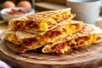 Cheesy Breakfast Wraps with Crispy Bacon, Fluffy Scrambled Eggs, and Melted Cheddar Cheese for the Perfect Breakfast
