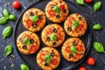 Easy Homemade Mini Pizza Tarts on a Dark Marble Surface – Perfect Bite-Sized Party Appetizer Recipe