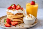 Easy Fluffy Pancakes with Fresh Strawberries and Crunchy Granola for a Delicious Breakfast