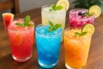 Colorful Cocktails on a Rustic Wooden Table – Vibrant Mixed Drink Ideas for Parties and Celebrations
