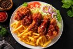 Crispy Fried Chicken with French Fries and Fresh Salad for a Delicious and Satisfying Family Meal